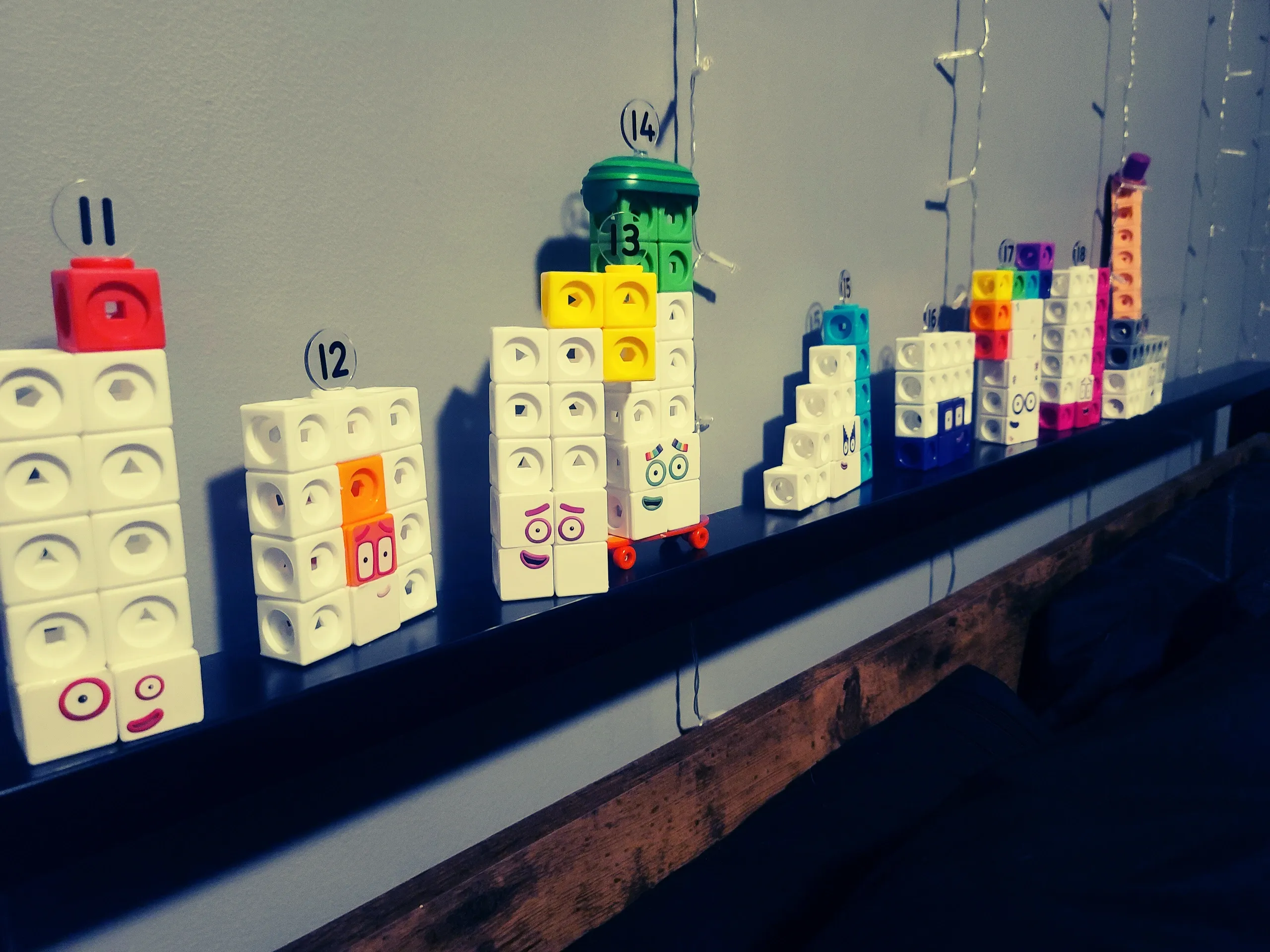 Toys lined up on bed